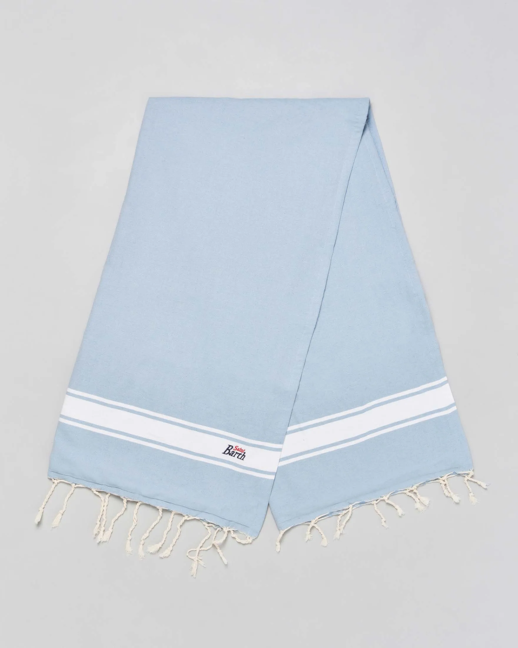 Telo mare in cotone color azzurro con riga al fondo bianca, frange e logo ricamato